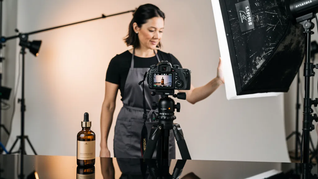 Click to manage / replace image Professional photographer setting up a shot for a high-quality product image for an Amazon store.